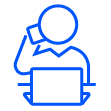 Person in front of laptop with cell phone